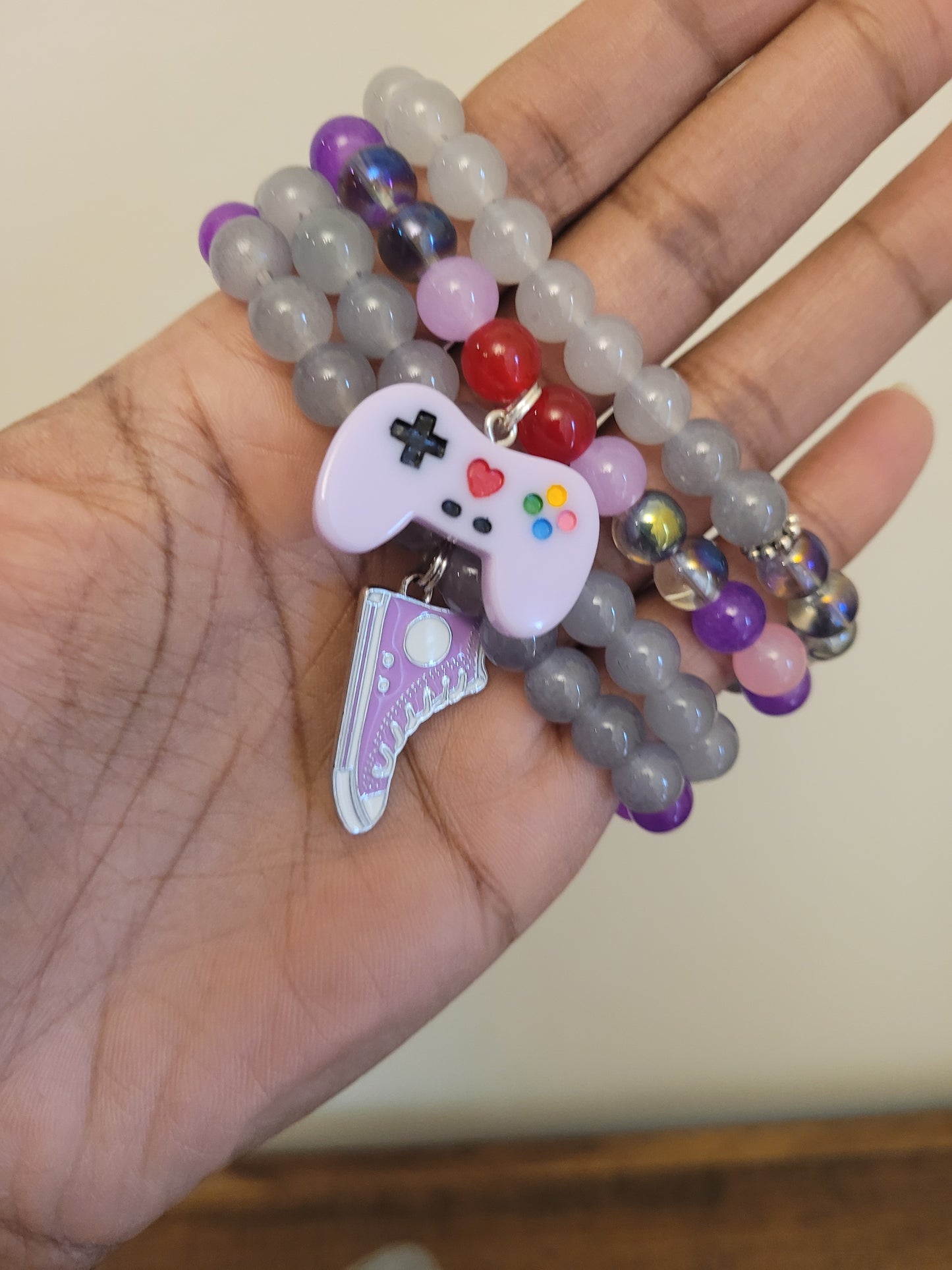 Purple and Pink Shoe and Game Charm Bracelets